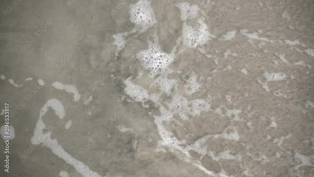 Water closeup on sandy coastline of Baltic sea Water closeup on sandy coastline of Baltic sea