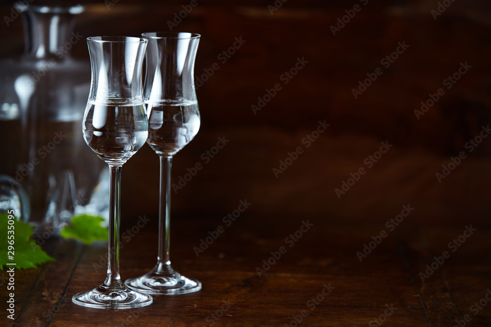 Elegant high tulip grappa glasses with copy space Elegant high tulip grappa glasses with copy space