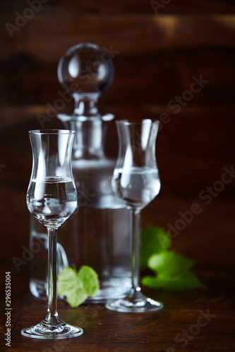 Two glasses of grappa bianca and decanter