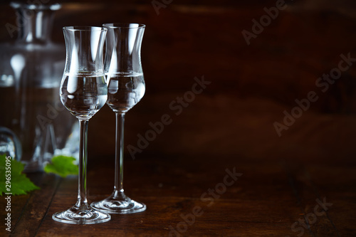 Elegant high tulip grappa glasses with copy space