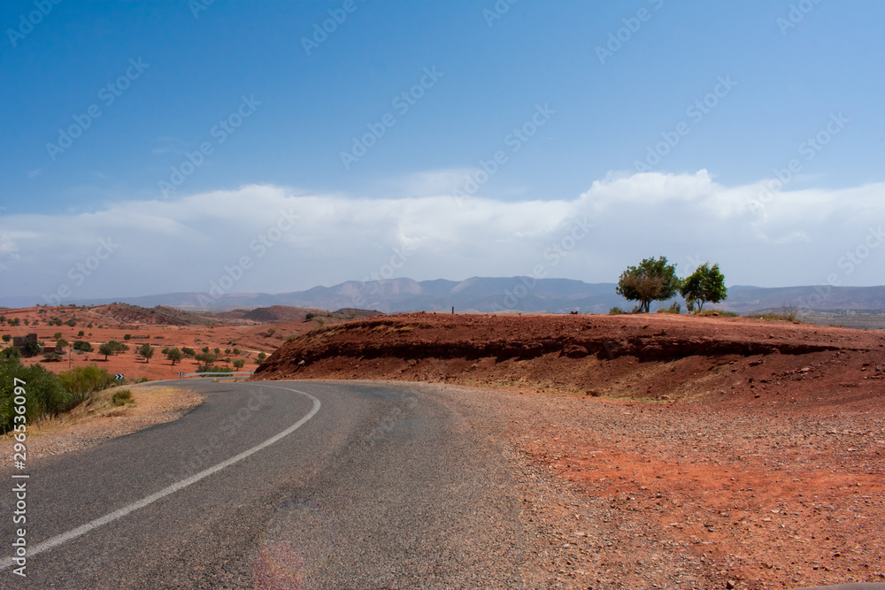 Fototapeta premium High atlas mountains in Morocco, North Africa. Empty asphalt road, beautiful landscape, sunny day 