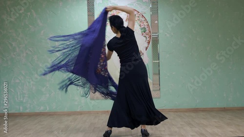 girl dances with a flamenco shawl