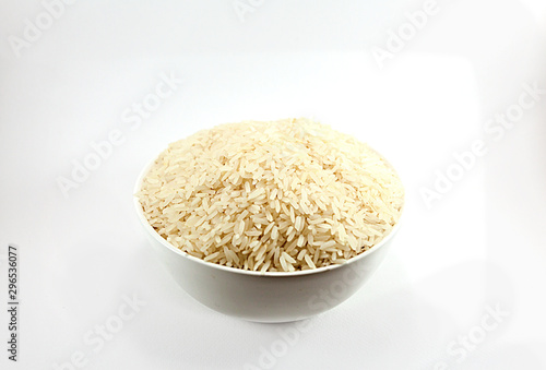 Jasmine rice cultivated in Thailand is in a white cup,isolated white background