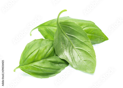 Close up green basil herb leaves isolated on white background.