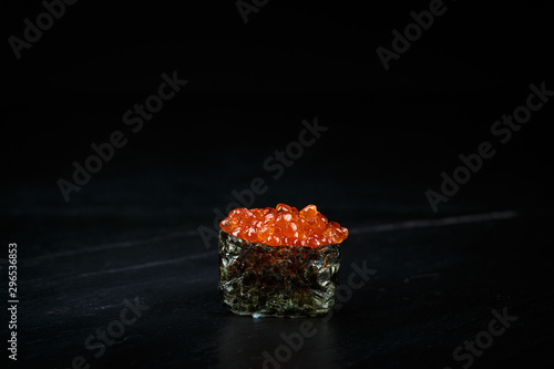 japanese cuisine single gunkan ikura with red caviar photo