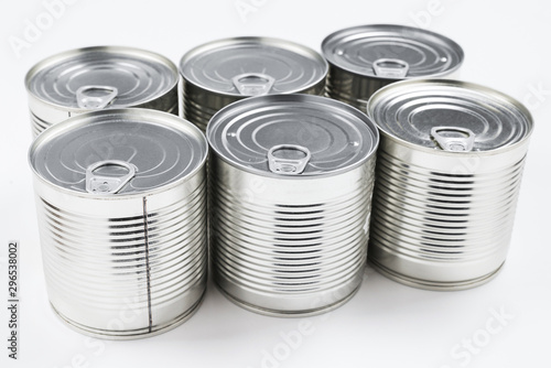 Group of silver canned food on white background.