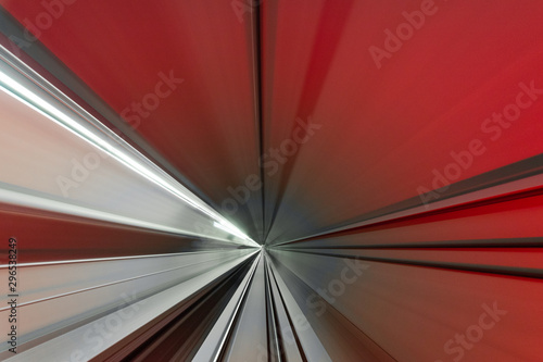 A high speed movement in tunnel in straight line with red light on.