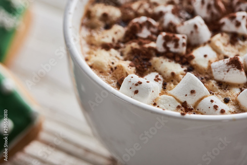 close up view of cacao with marshmallow in mug