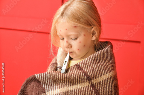 Fotografie Little girl ill with chickenpox on color background