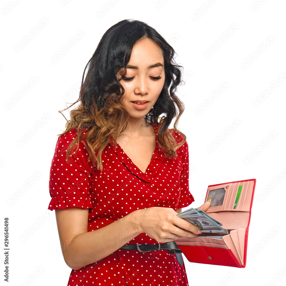 Asian woman putting money into wallet on white background Asian woman putting money into wallet on white background