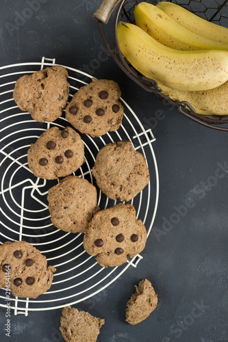 whole grain crakers over an oven rack and a basket with bananas photo