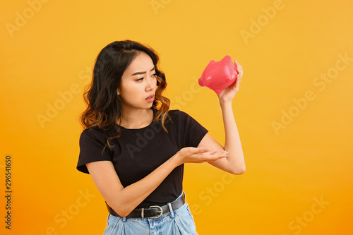 Sad Asian woman with empty ...