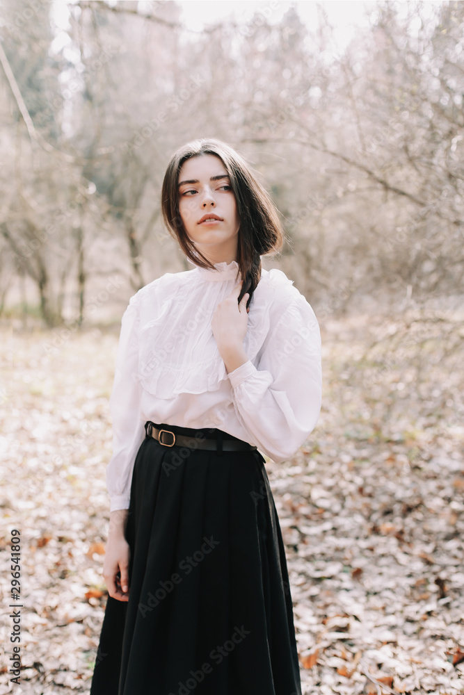 Beautiful dreamy girl portrait. Romantic portrait of a beautiful girl in the park Beautiful dreamy girl portrait. Romantic portrait of a beautiful girl in the park