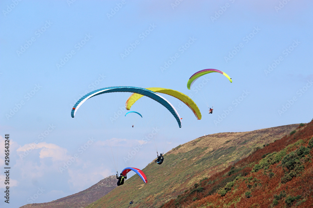 Paragliders flying above Rhossili Paragliders flying above Rhossili