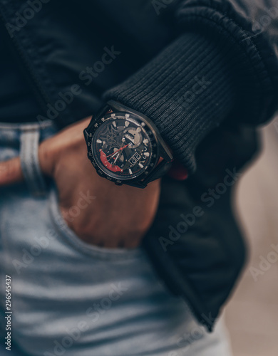 Stylish fashion black watch on woman hand