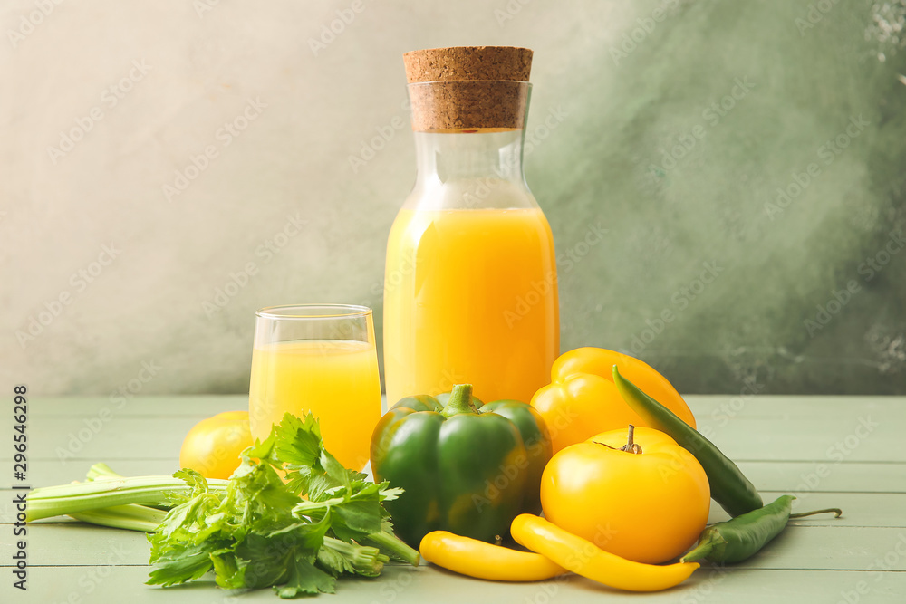 Glass and bottle of fresh vegetable juice on table Glass and bottle of fresh vegetable juice on table