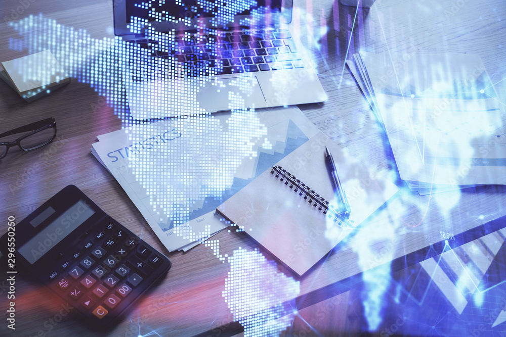 Financial chart drawing and table with computer on background. Multi exposure. Concept of international markets. Financial chart drawing and table with computer on background. Multi exposure. Concept of international markets.