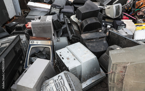 Close up on pile of broken televisions and computer monitors at an  electronic waste recycle centre photo