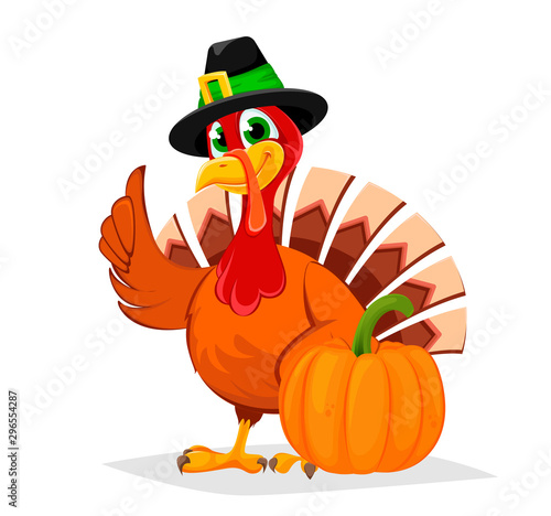 Thanksgiving turkey standing near big pumpkin