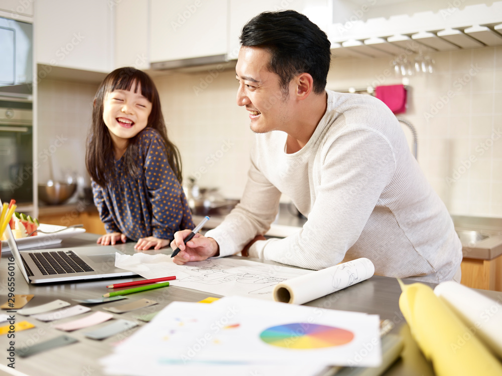 young asian father enjoying working at home young asian father enjoying working at home