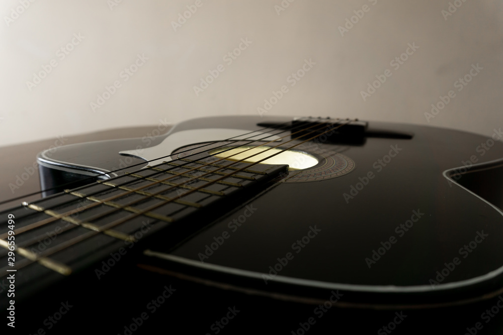 Fototapeta premium Black classic guitar in perpective