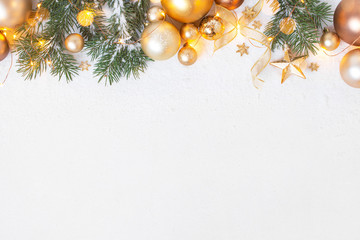 Christmas festive background with fir branches and golden christmas decoranion