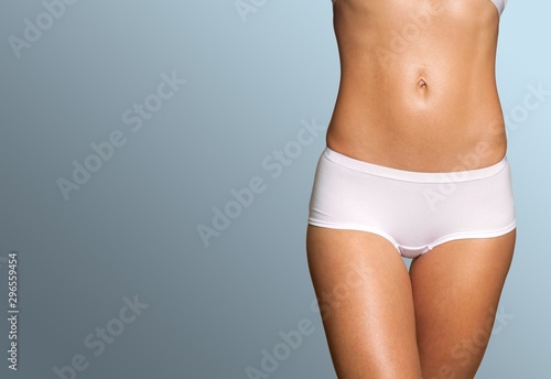 Beautiful slim female body on gradient background © BillionPhotos.com