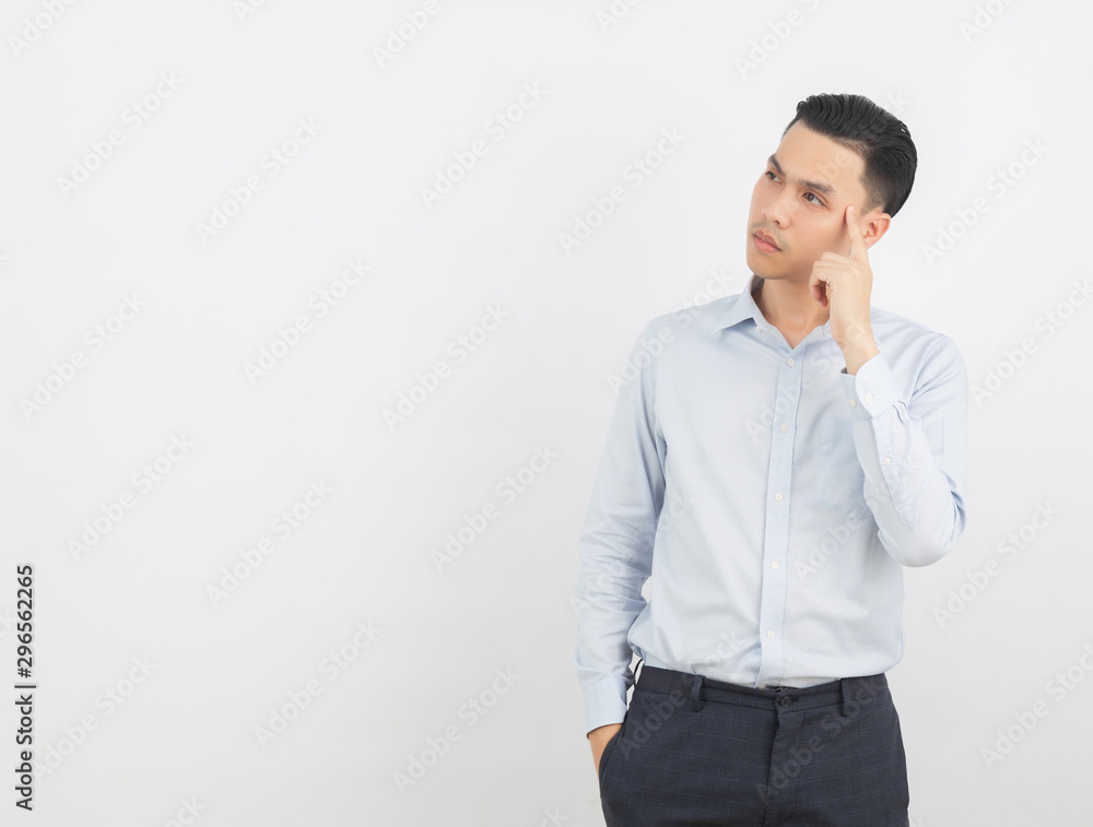 Young handsome asian business man thinking an idea while looking up isolated on white background. Young handsome asian business man thinking an idea while looking up isolated on white background.