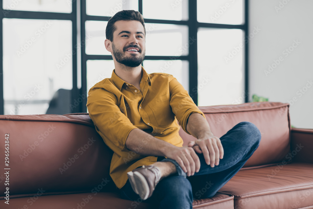 Photo of handsome guy in amazing working mood in love with his job listening boss startup explaining sitting office couch in modern workspace indoors Photo of handsome guy in amazing working mood in love with his job listening boss startup explaining sitting office couch in modern workspace indoors