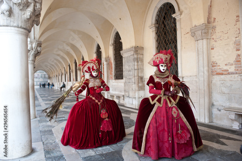 A pair of masks perform for the Venice carnival in Piazza San Marco. Italy.