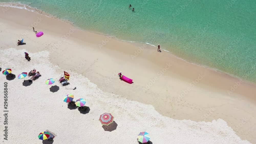 Aerial view of Surin beach, Phuket, Thailand, Surin beach is a very famous tourist destination in Phuket, Tropical sandy beach with turquoise clear water, Tourist on the beach and colorfull umbrellas. Aerial view of Surin beach, Phuket, Thailand, Surin beach is a very famous tourist destination in Phuket, Tropical sandy beach with turquoise clear water, Tourist on the beach and colorfull umbrellas.
