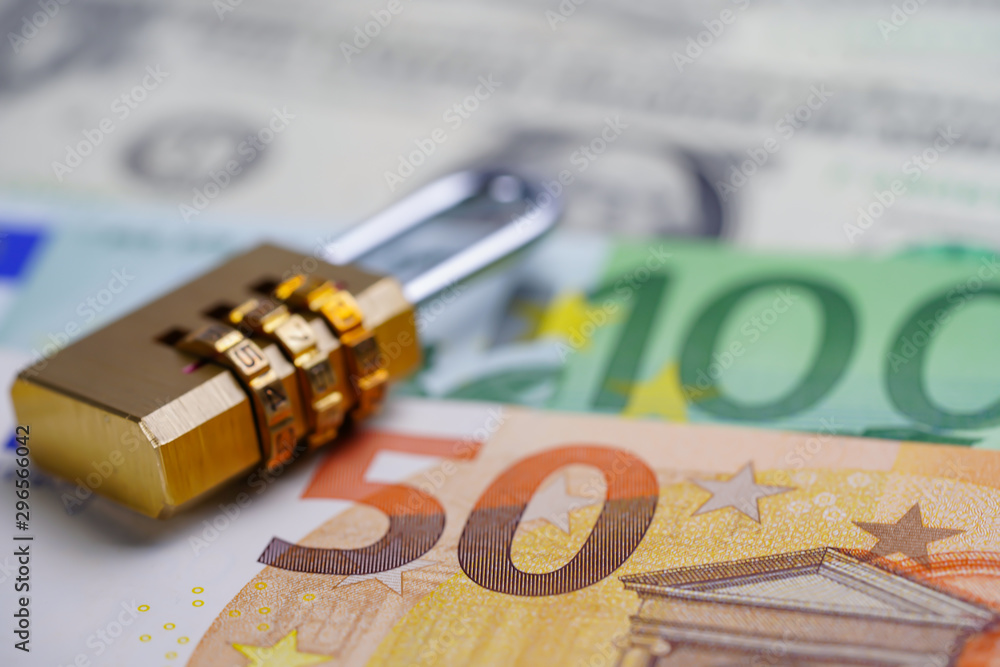Golden security digital password lock key on Euro banknotes : Finance security concept.. Golden security digital password lock key on Euro banknotes : Finance security concept..