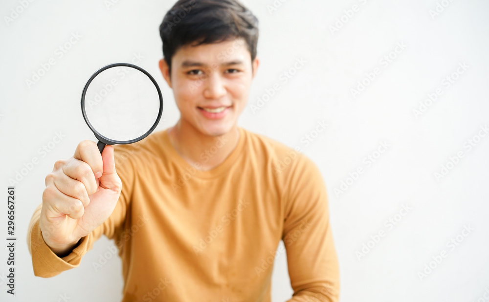 close up man hand holding magnifier glass for searching background concept close up man hand holding magnifier glass for searching background concept