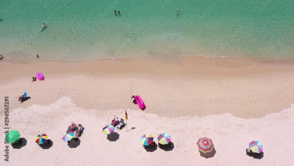 Aerial view of Surin beach, Phuket, Thailand, Surin beach is a very famous tourist destination in Phuket, Tropical sandy beach with turquoise clear water, Tourist on the beach and colorfull umbrellas. Aerial view of Surin beach, Phuket, Thailand, Surin beach is a very famous tourist destination in Phuket, Tropical sandy beach with turquoise clear water, Tourist on the beach and colorfull umbrellas.