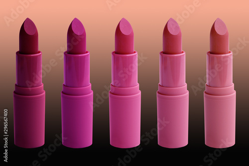set of matte lipstick on a dark background, red, raspberry, pink, coral, peach color, close-up, the concept of decorative cosmetics