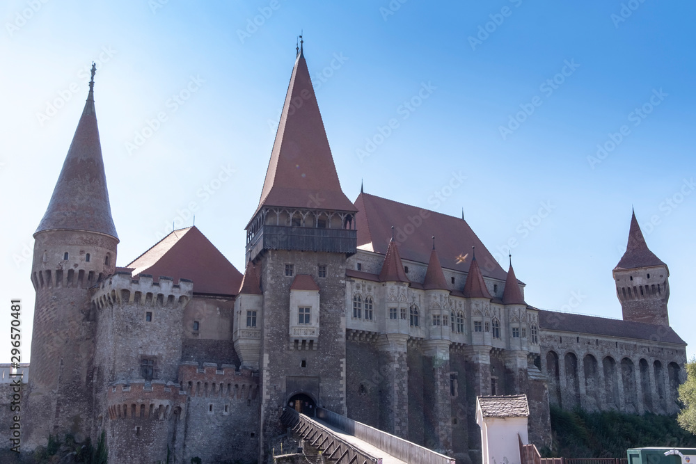 Corvin Castle or Hunyadi Castle in Hunedoara, Romania in bright sunlight.