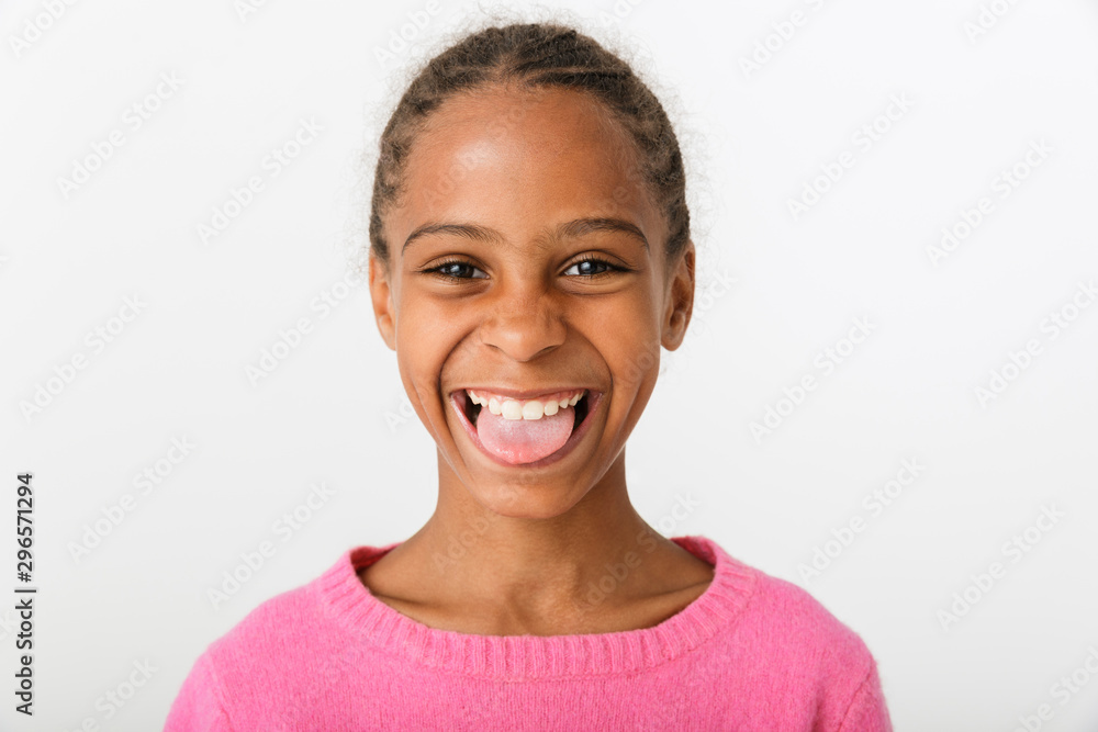Image of amusing african american girl laughing and sticking out her tongue Image of amusing african american girl laughing and sticking out her tongue