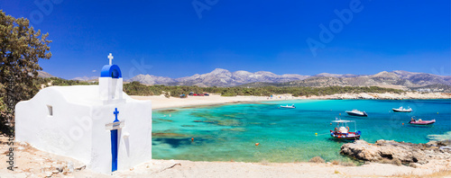 Traditional Greece - small church on the turquoise beach. Naxos island