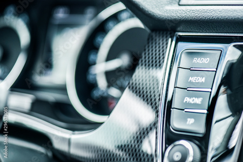Car dashboard buttons like volume, climatronic, navigation, display,menu, setup, sound  and speed control meter. photo