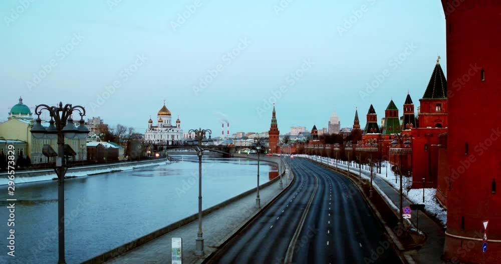 Moscow, Russia. Aerial view of popular landmark - Kremlin, Moscow, Russia in the morning. Almost empty road with few car, clear blue sky Moscow, Russia. Aerial view of popular landmark - Kremlin, Moscow, Russia in the morning. Almost empty road with few car, clear blue sky