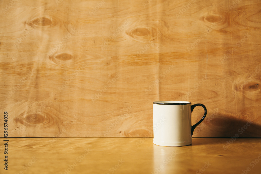 white cup on a wooden background. engineering background. white cup on a wooden background. engineering background.