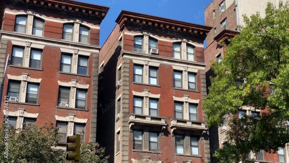 A daytime exterior establishing shot of typical upscale apartment ... - Manhattan Upscale Residence Developers