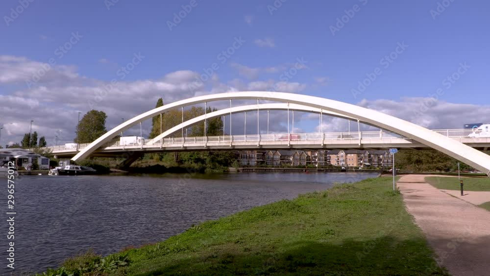 Bridge by the river under blue skies Bridge by the river under blue skies