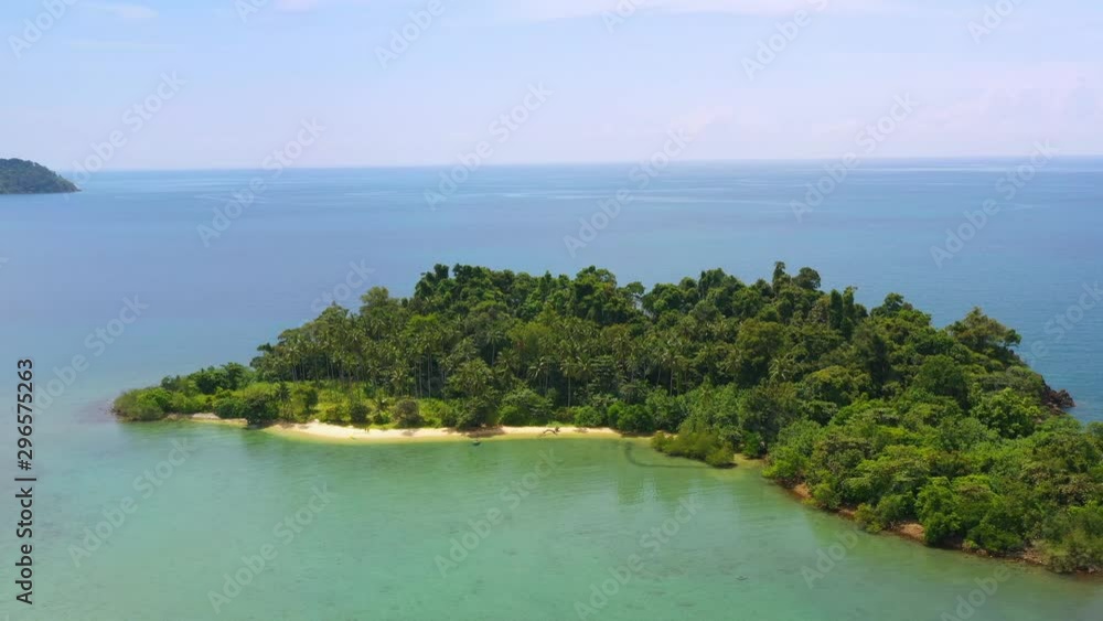 Aerial view on the sea. Small tropical island with palm trees and sandy beach.