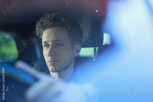 Close up of young driver in nature with reflections 