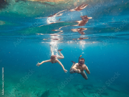 Father and daughter snorkeling in the sea