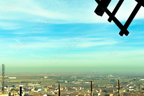 The Villa Behind a Mill Blade On Top Of The Mountain Next To The Windmills In Consuegra. December 26, 2018. Consuegra View Of The Villa On Top Of The Mountain Next To The Windmills In Consuegra.