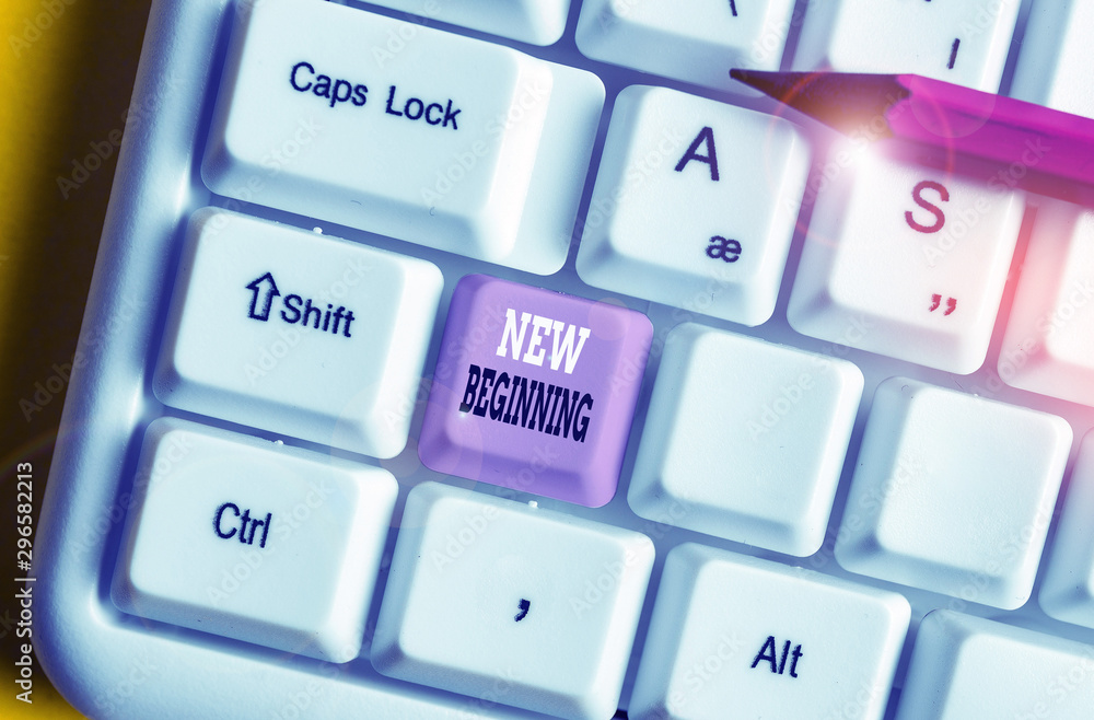 Writing note showing New Beginning. Business concept for Different Career or endeavor Starting again Startup Renew White pc keyboard with note paper above the white background Writing note showing New Beginning. Business concept for Different Career or endeavor Starting again Startup Renew White pc keyboard with note paper above the white background