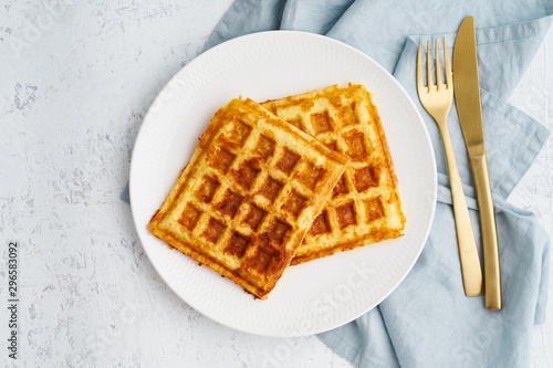 Chaffle, ketogenic diet health food. Homemade keto waffles with egg, mozzarella cheese. Gluten - free and carb-free. White background.