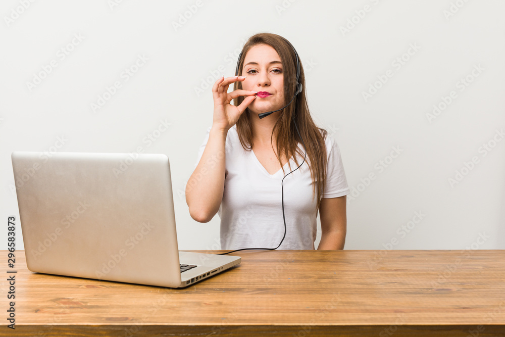 Young telemarketer woman with fingers on lips keeping a secret.